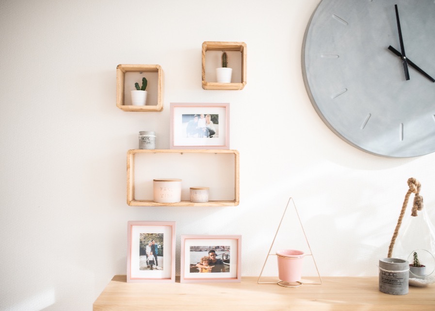 A tidy entryway station with leash hooks and a low bowl